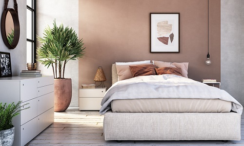 Moderne slaapkamer met bed en plant